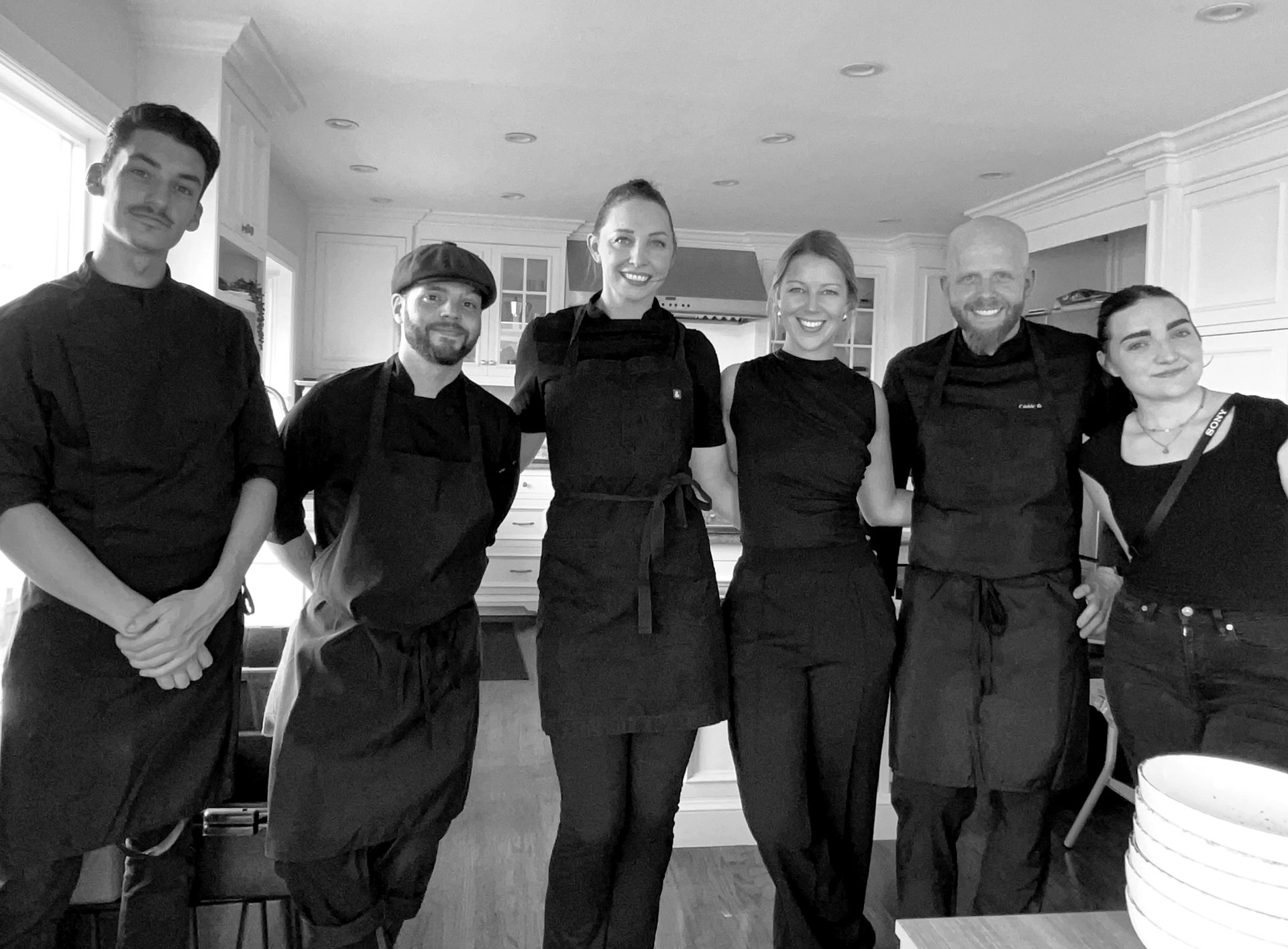 The Reiter Catering team lined up in a kitchen before service